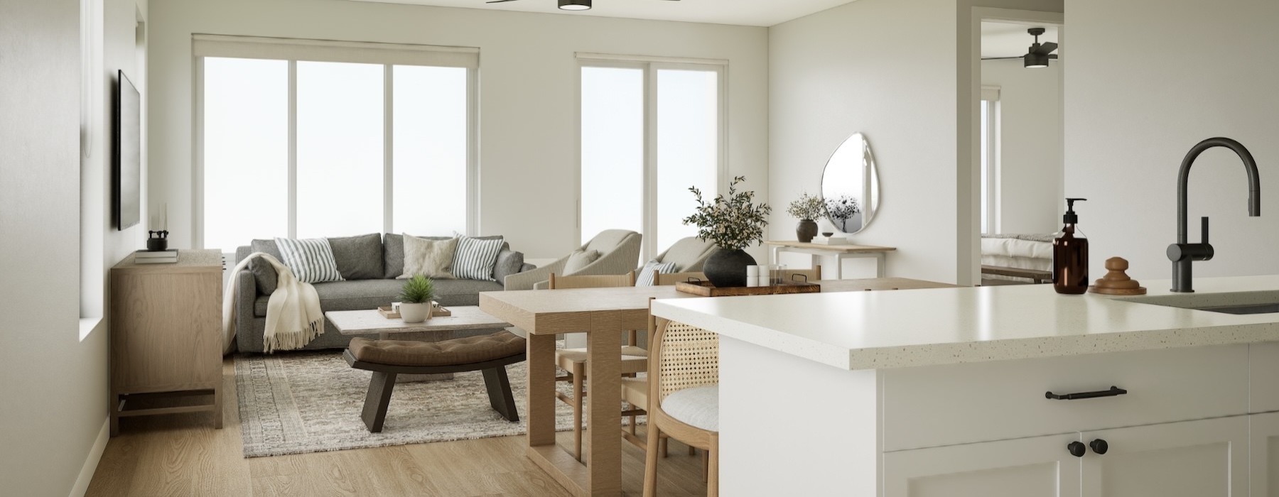 a kitchen and a living room with a couch and tables