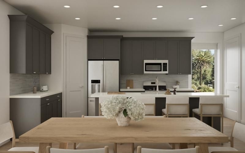 a kitchen with a table and chairs