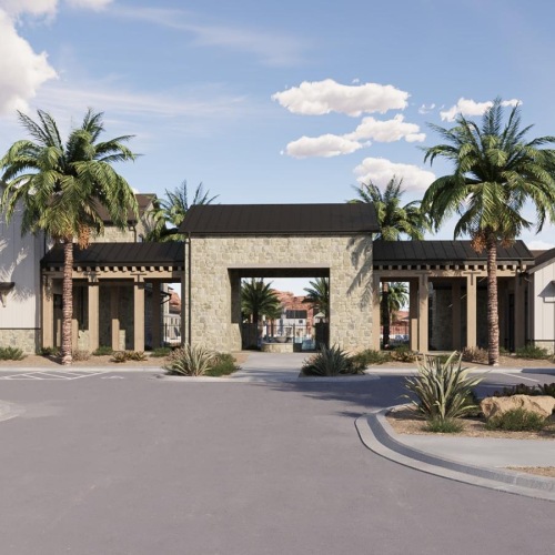 a building with palm trees and a parking lot