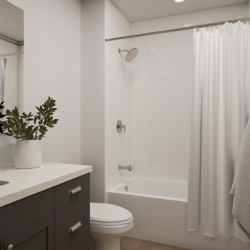 a bathroom with a bathtub, sink and toilet