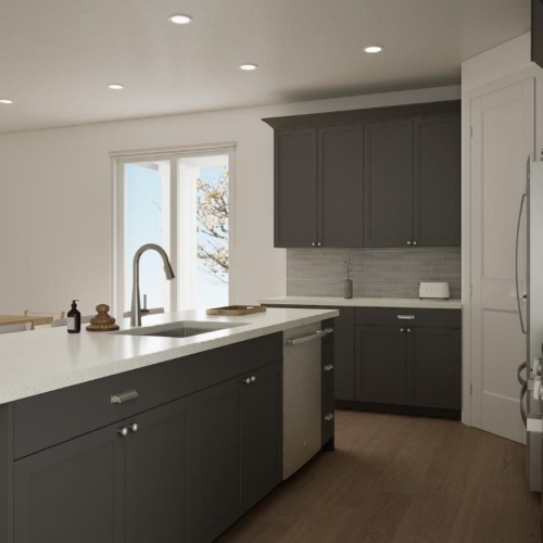 a kitchen with grey cabinets